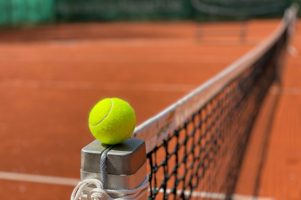 tennis ball on tennis court